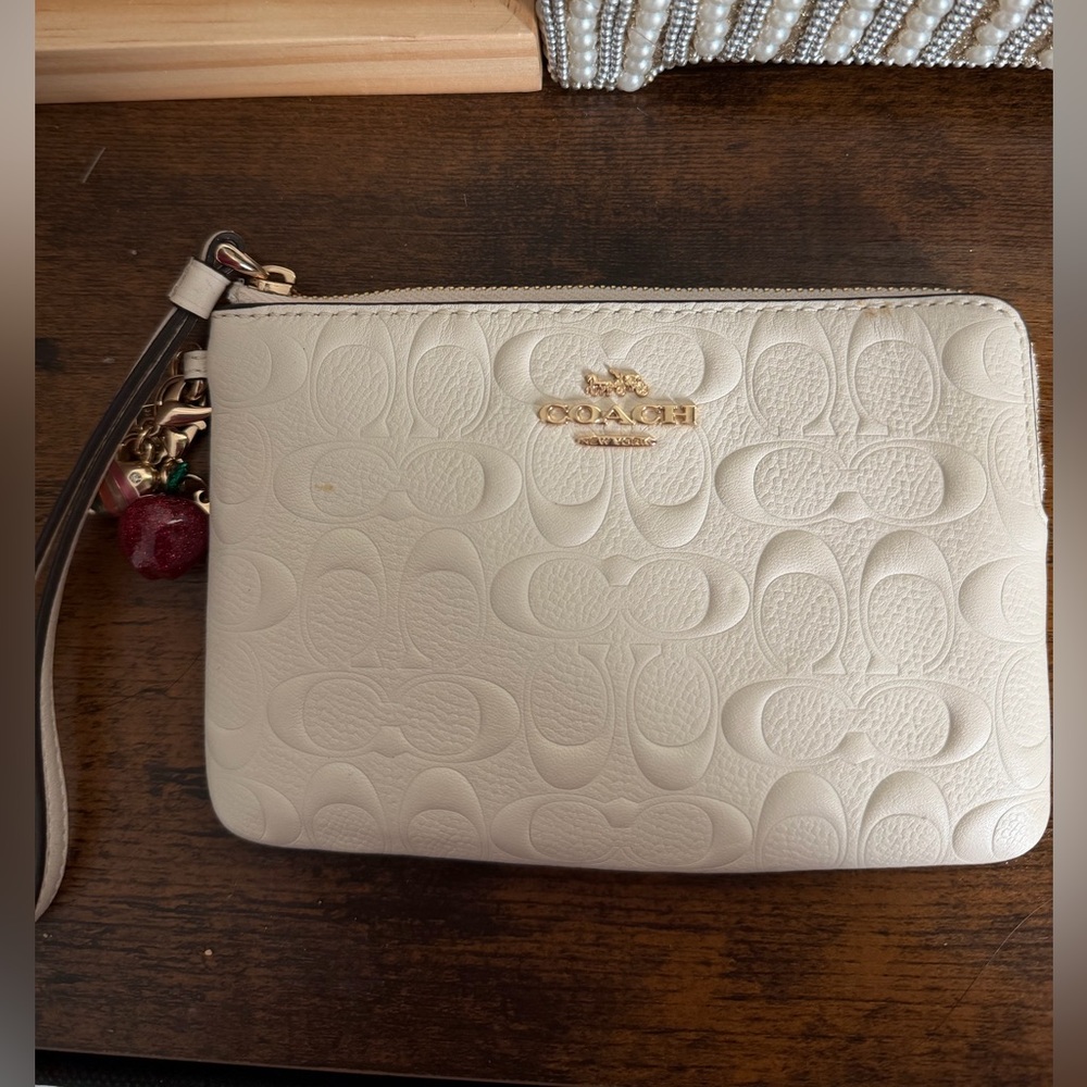 Coach Ivory Embossed Leather Wristlet